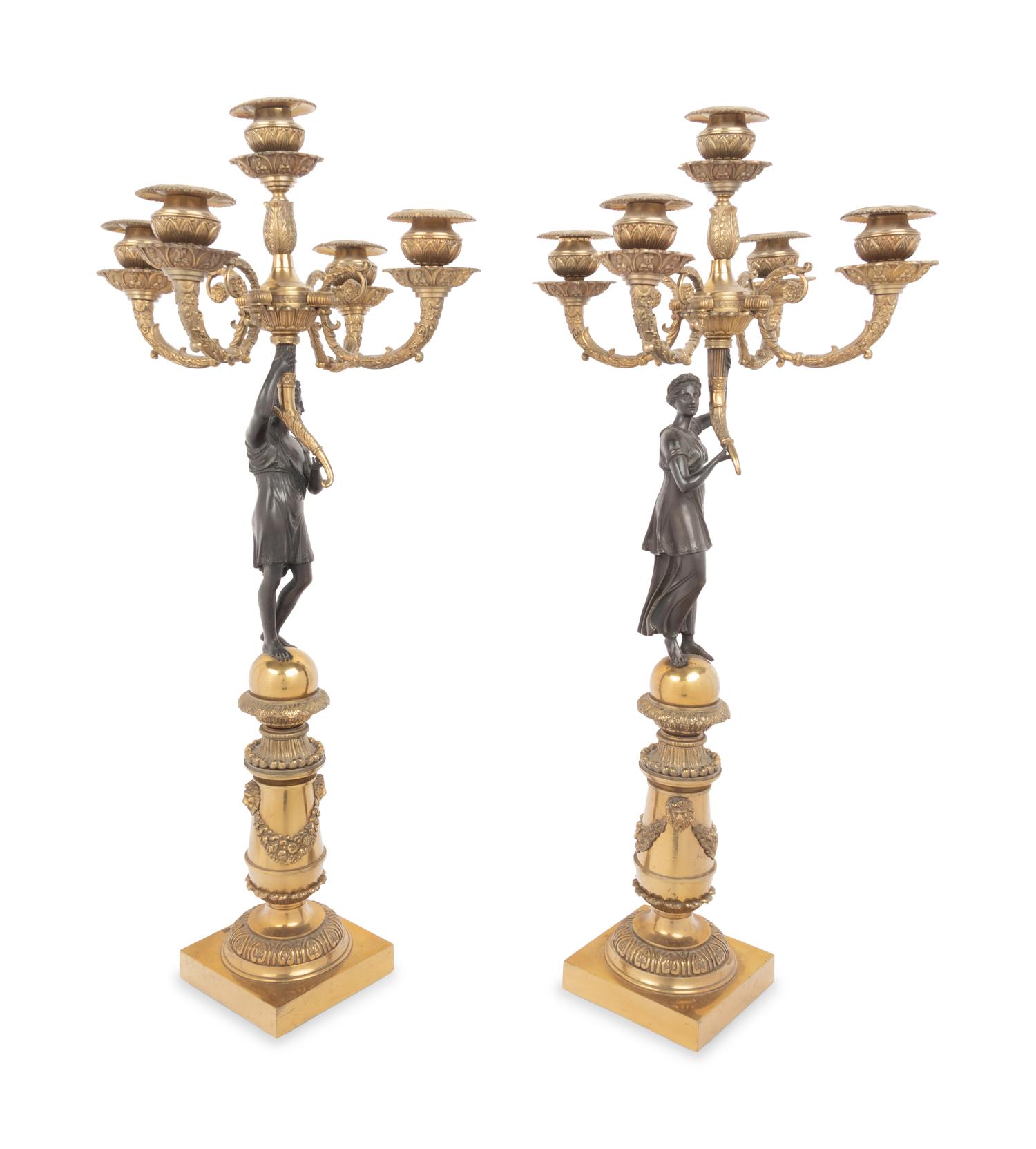 A Pair of Empire Style Gilt and Patinated Bronze Figural Five-Light Candelabra