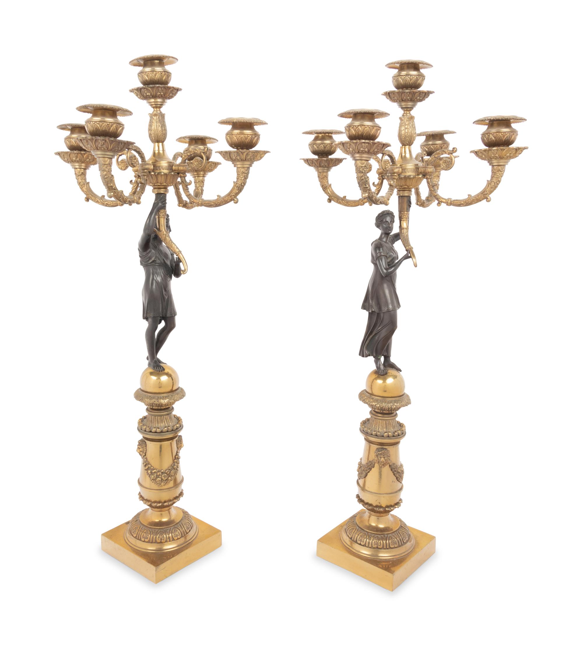 A Pair of Empire Style Gilt and Patinated Bronze Figural Five-Light Candelabra