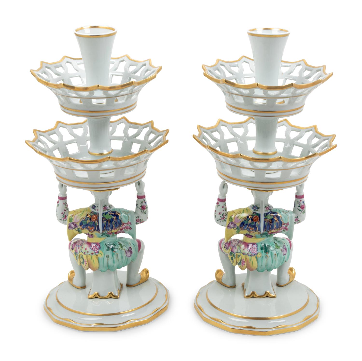 A Pair of Mottahedeh Parcel Gilt Tobacco Leaf Decorated Porcelain Figural Epergne