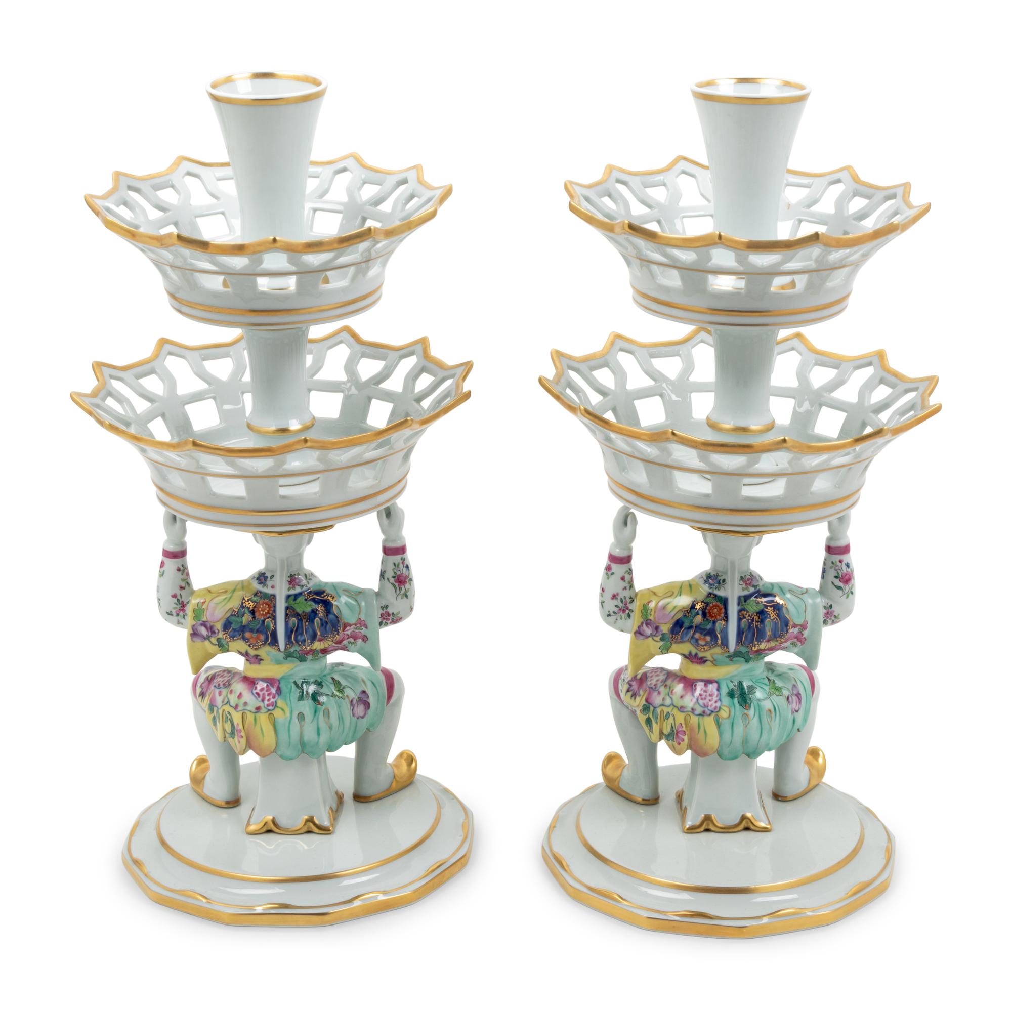 A Pair of Mottahedeh Parcel Gilt Tobacco Leaf Decorated Porcelain Figural Epergne