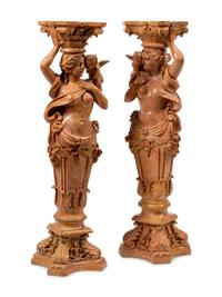 A Pair of Carved Marble Figural Pedestals