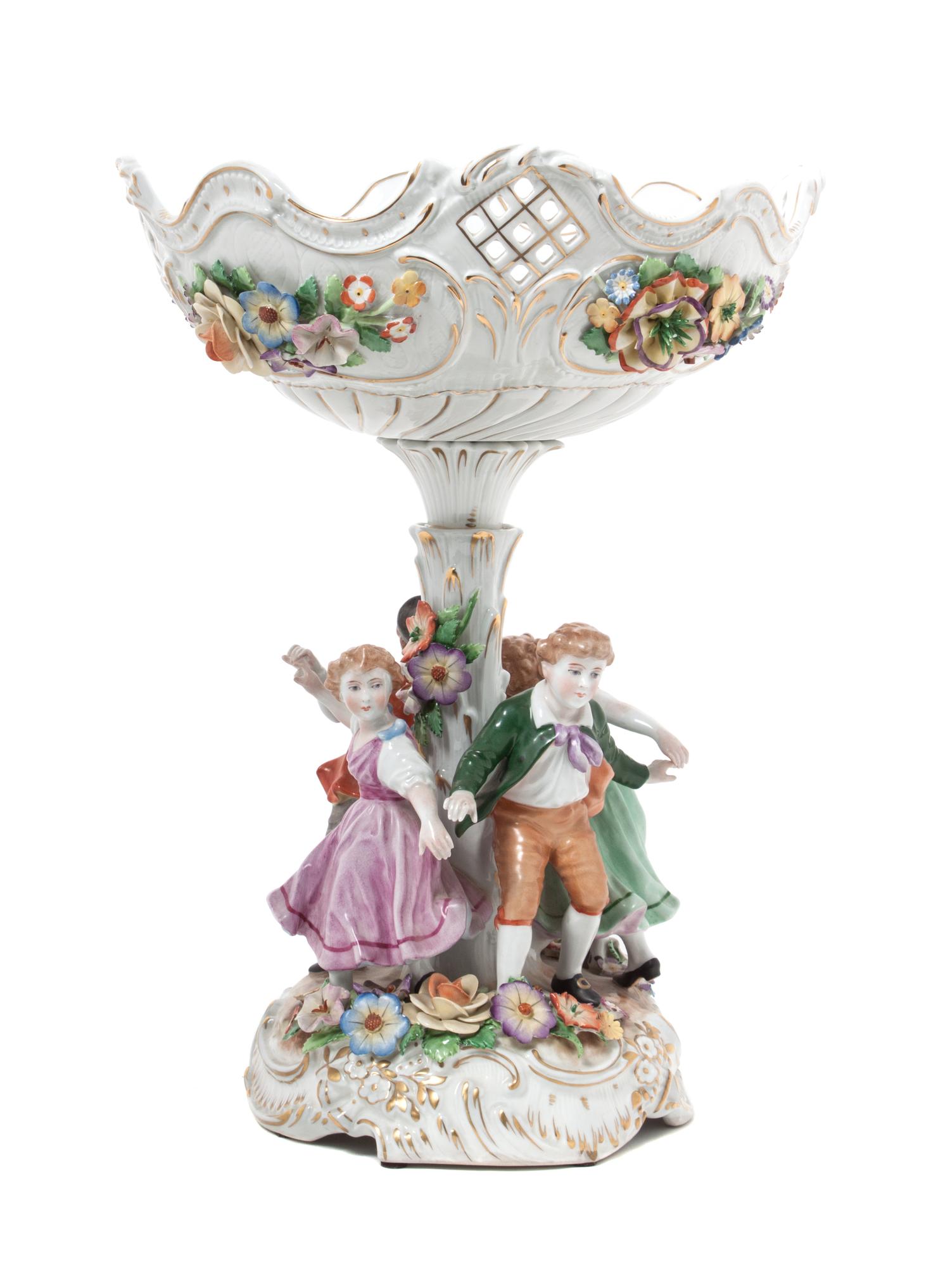 A Von Schierholz Porcelain Figural Compote Height 14 3/4 inches.