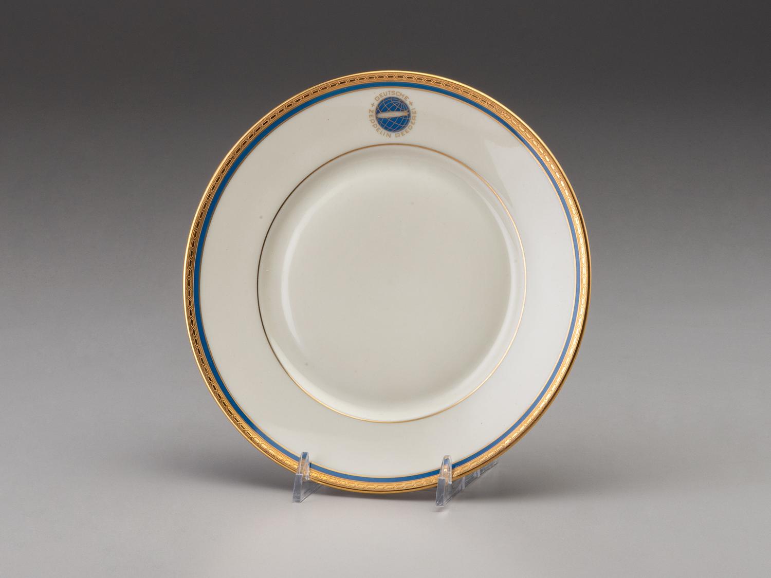 [TRANSPORTATION] - [ZEPPELIN]. Set of Deutsche Zeppelin-Reederei porcelain with dinner plates, salad plates, and sherbet glasses.