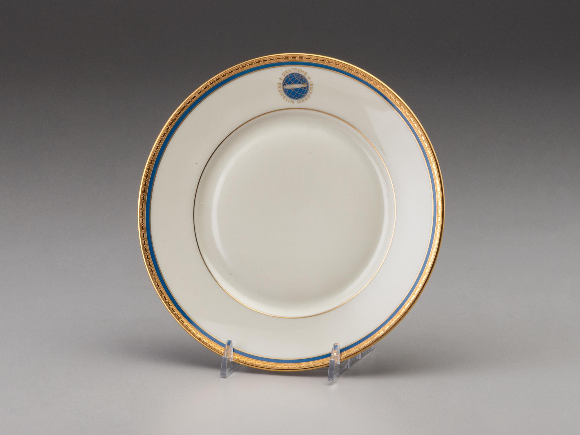 [TRANSPORTATION] - [ZEPPELIN]. Set of Deutsche Zeppelin-Reederei porcelain with dinner plates, salad plates, and sherbet glasses.