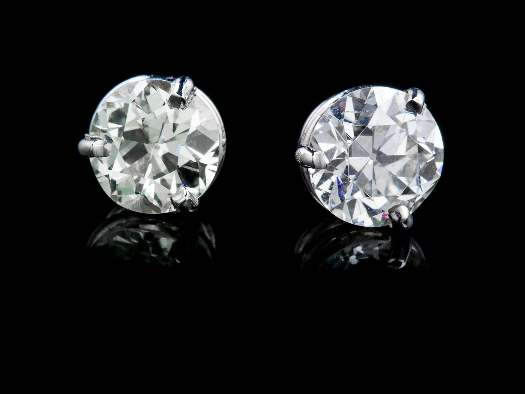A Pair of White Gold and Old European Cut Diamond Stud Earrings, 1.50 dwts.