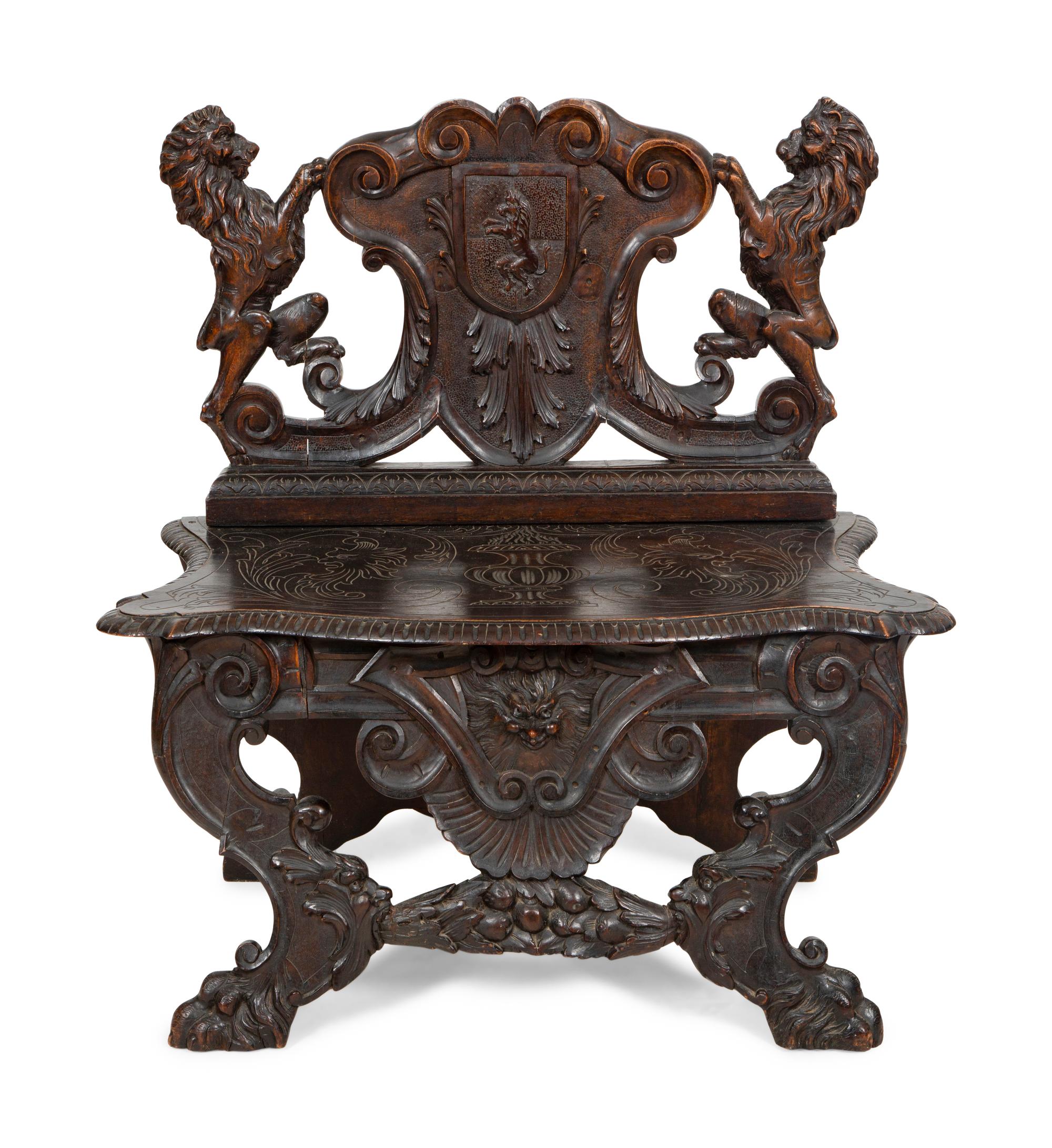 A Jacobean Style Carved Oak Bench with Armorial and Lion Carved Back