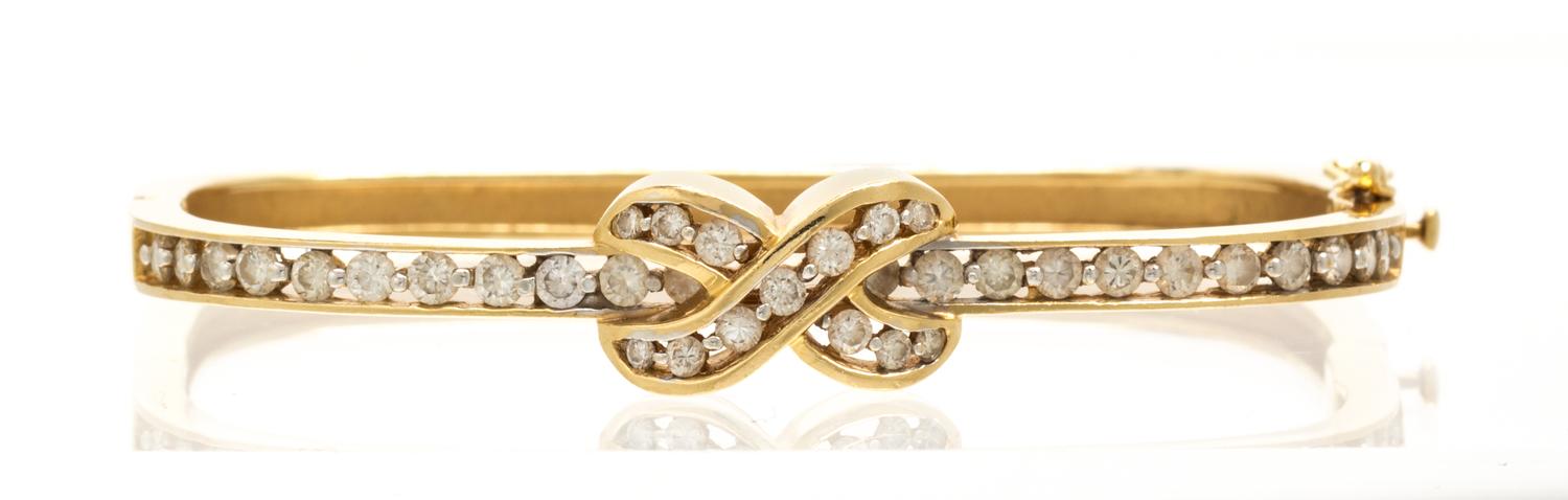 A 14 Karat Yellow Gold and Diamond Bangle Bracelet, 11.60 dwts.
