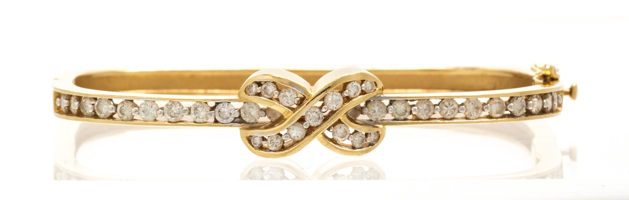A 14 Karat Yellow Gold and Diamond Bangle Bracelet, 11.60 dwts.