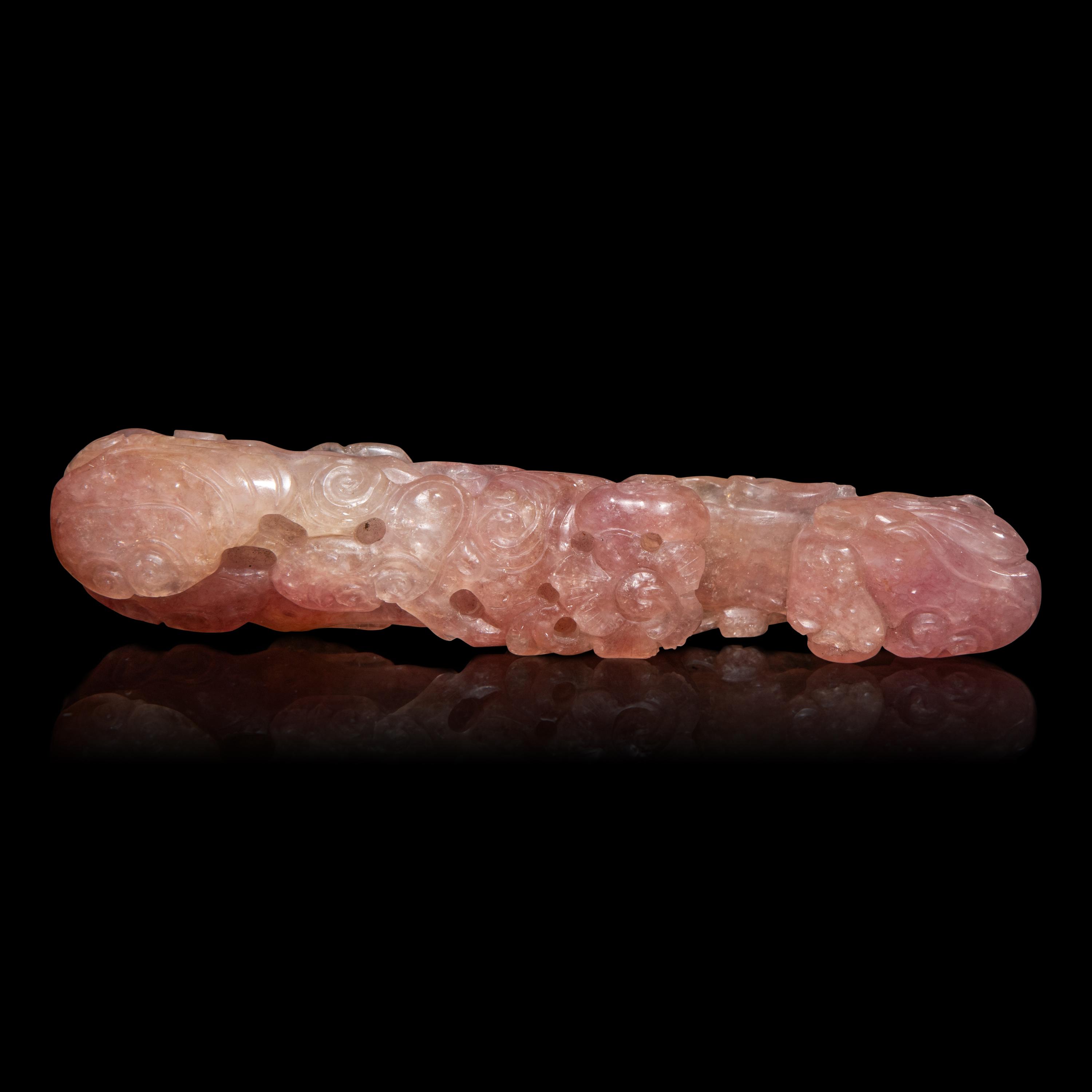 A Chinese Pink Tourmaline 'Dragon and Lingzhi' Belt Hook, 19th Century — 清晚期 碧璽螭龍帶鈎