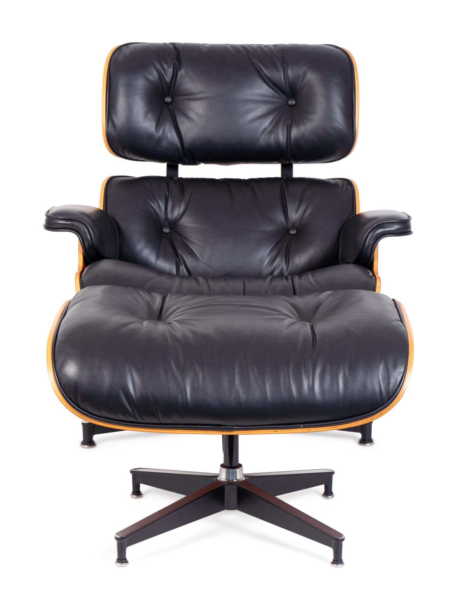 An Eames Laminated Walnut and Black Leather Lounge and Ottoman — FOR HERMAN MILLER