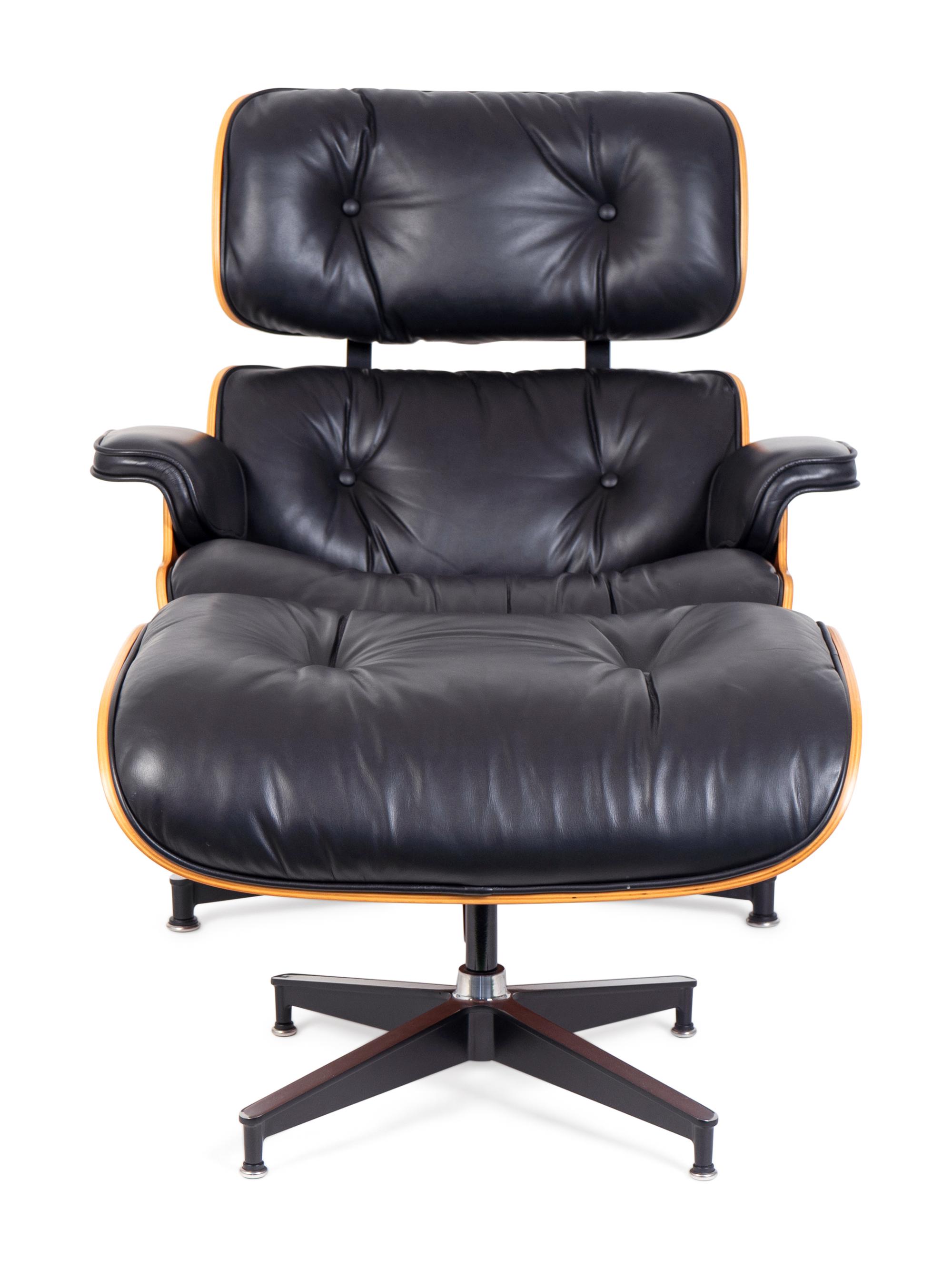 An Eames Laminated Walnut and Black Leather Lounge and Ottoman — FOR HERMAN MILLER