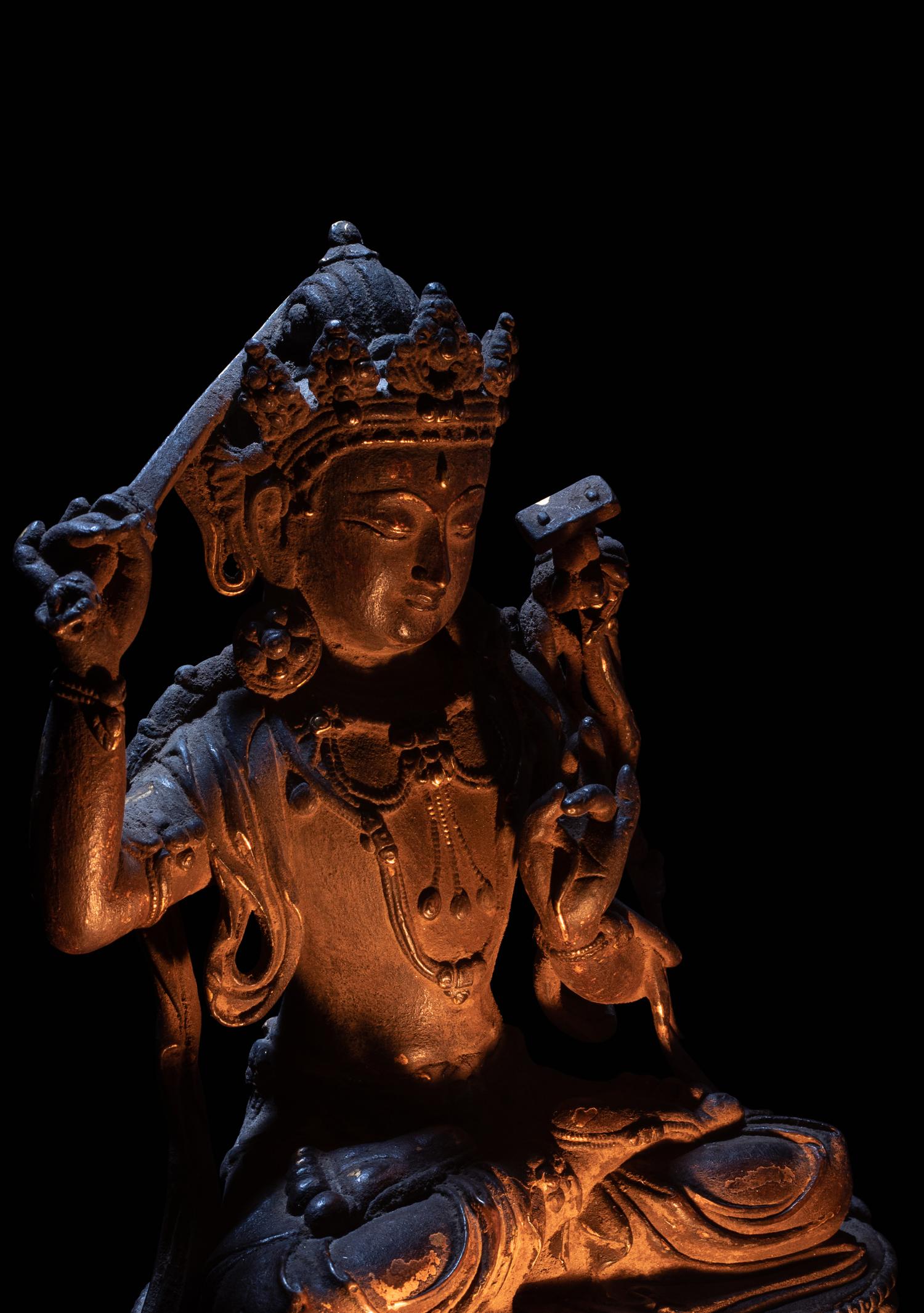A Sino-Tibetan Parcel-Gilt Bronze Figure of Manjushri