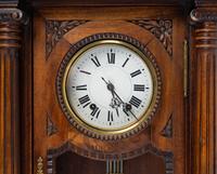 A Renaissance Revival Carved Walnut Regulator Clock