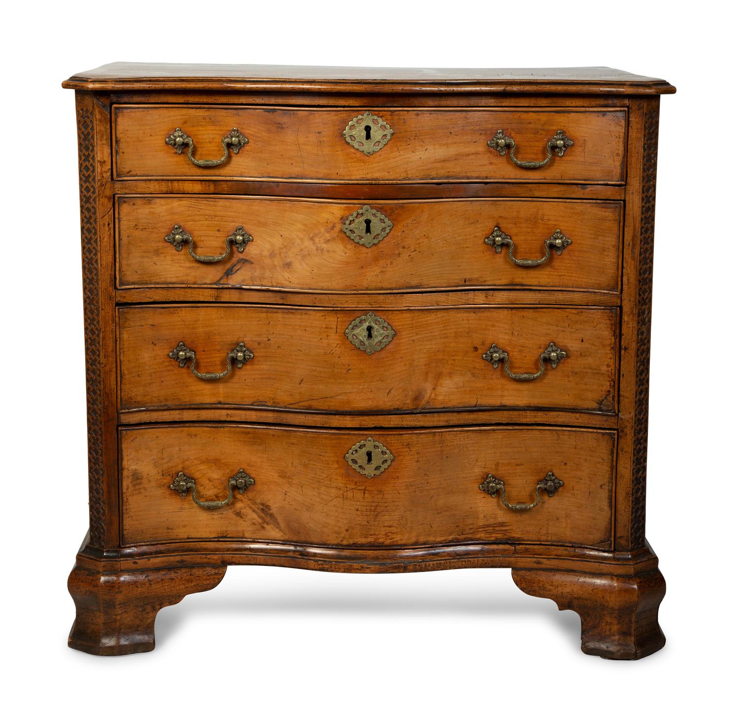 A George III Walnut Serpentine Chest of Drawers — 18TH CENTURY