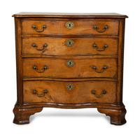 A George III Walnut Serpentine Chest of Drawers — 18TH CENTURY