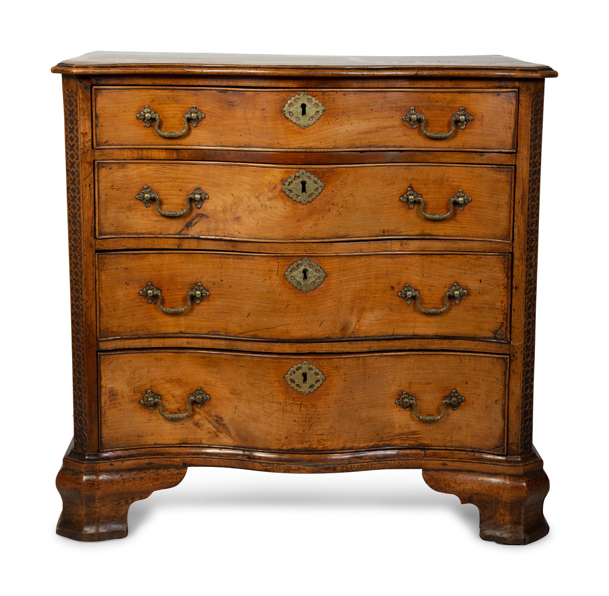 A George III Walnut Serpentine Chest of Drawers — 18TH CENTURY