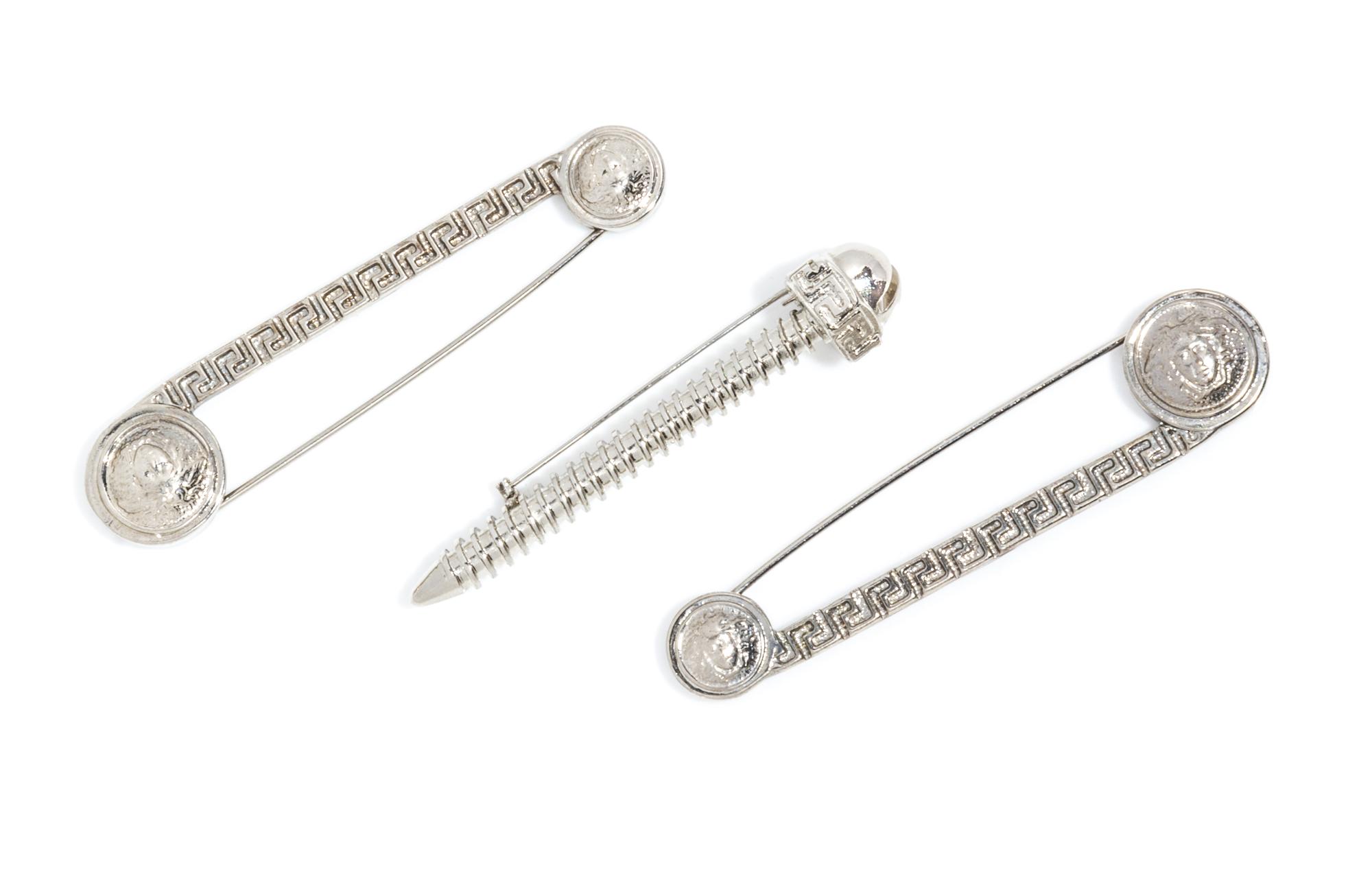 A Collection of Gianni Versace Safety Pin and Screw Brooches,