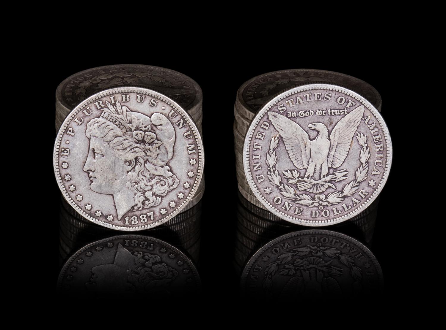 A Group of Twenty-Three United States 1887-O Morgan Silver Dollar Coins
