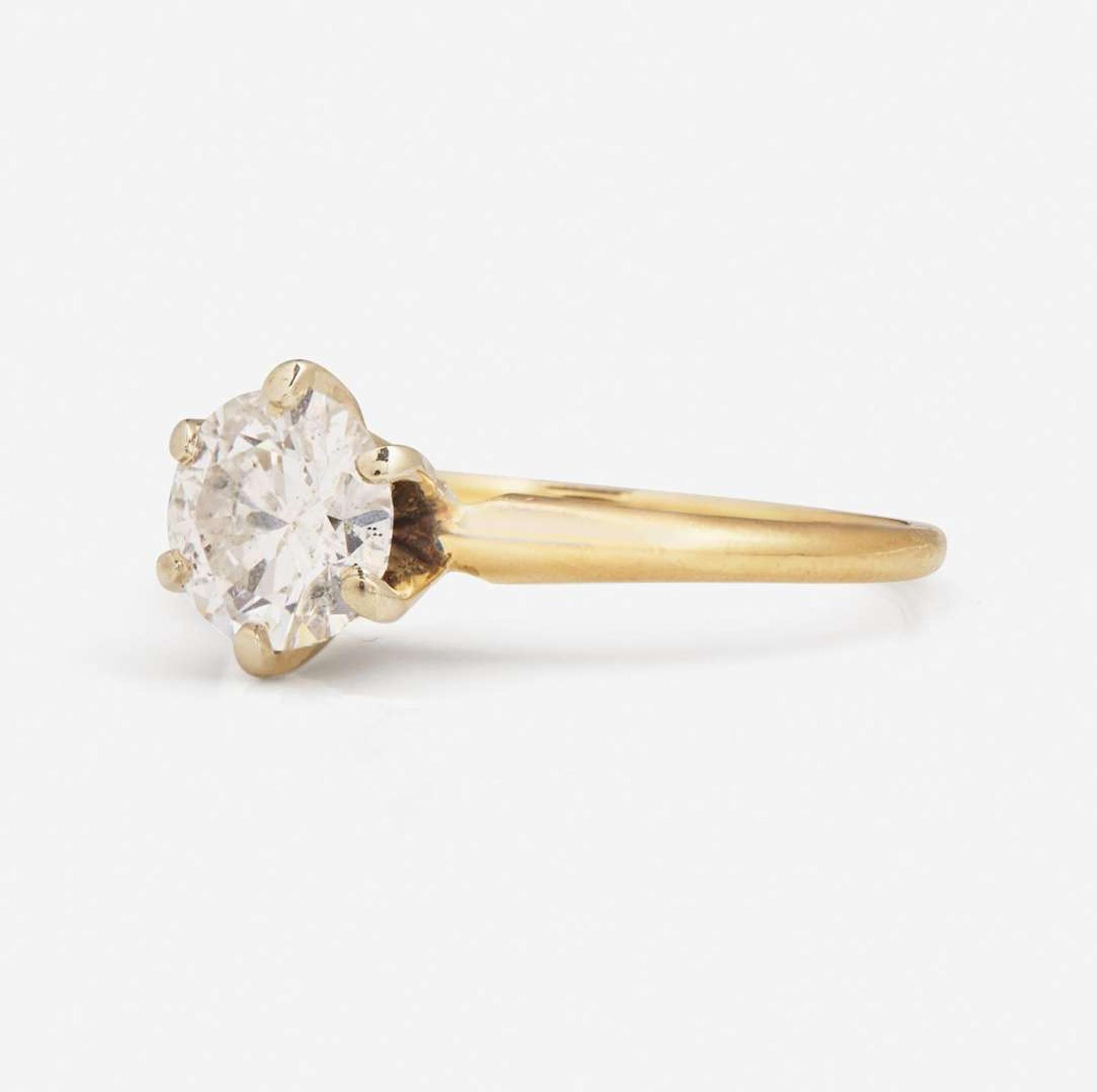 A 14K Yellow Gold Solitaire Diamond Ring