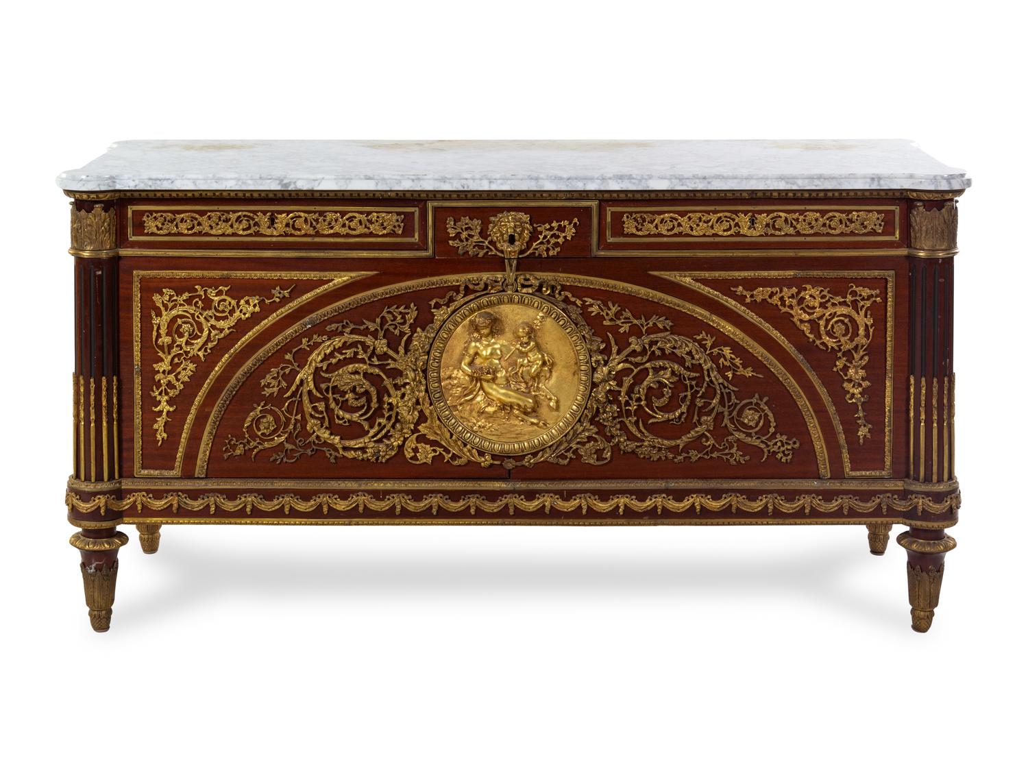 A Louis XVI Style Gilt Bronze Mounted Mahogany Commode a Vantaux