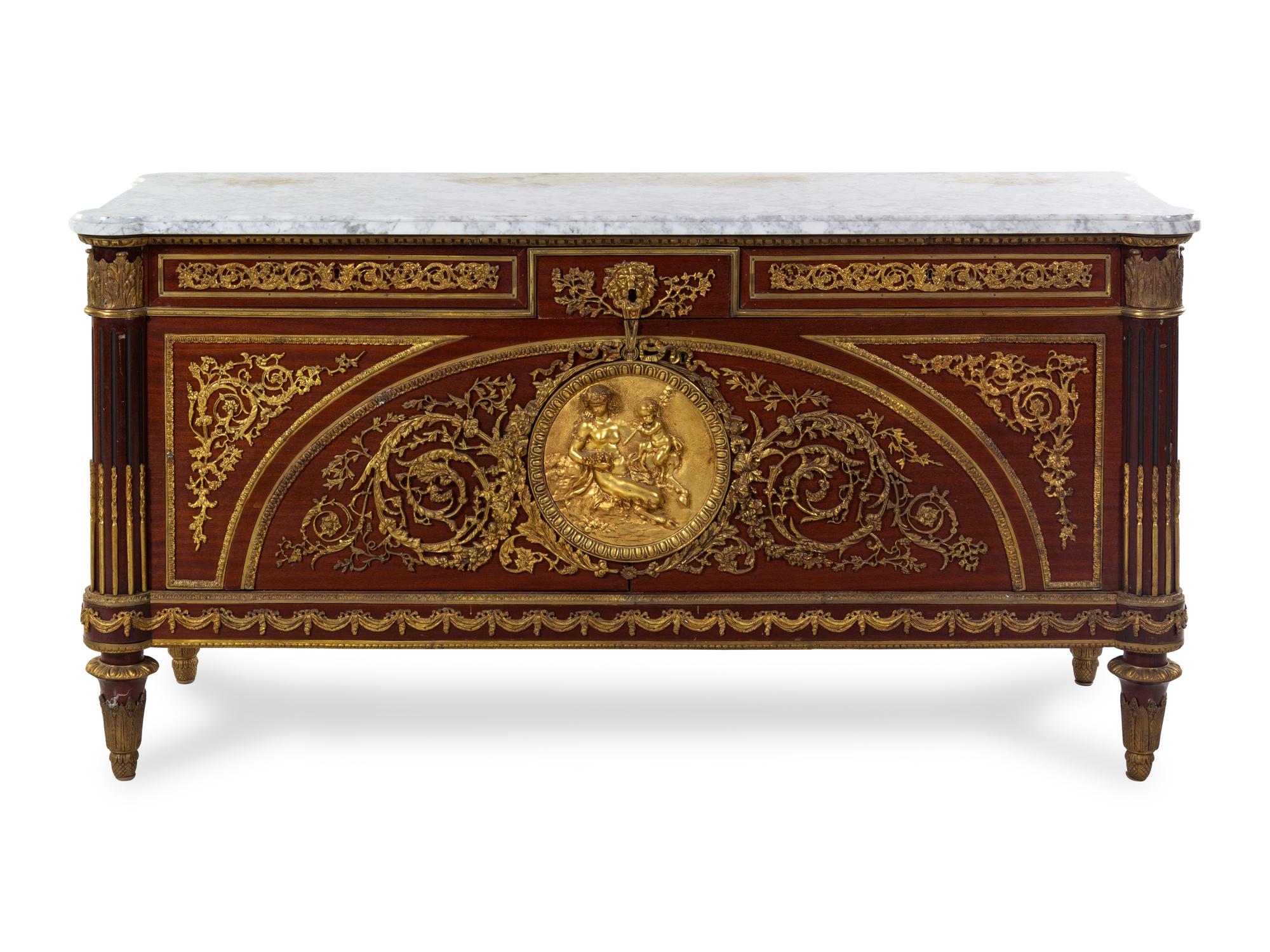 A Louis XVI Style Gilt Bronze Mounted Mahogany Commode a Vantaux
