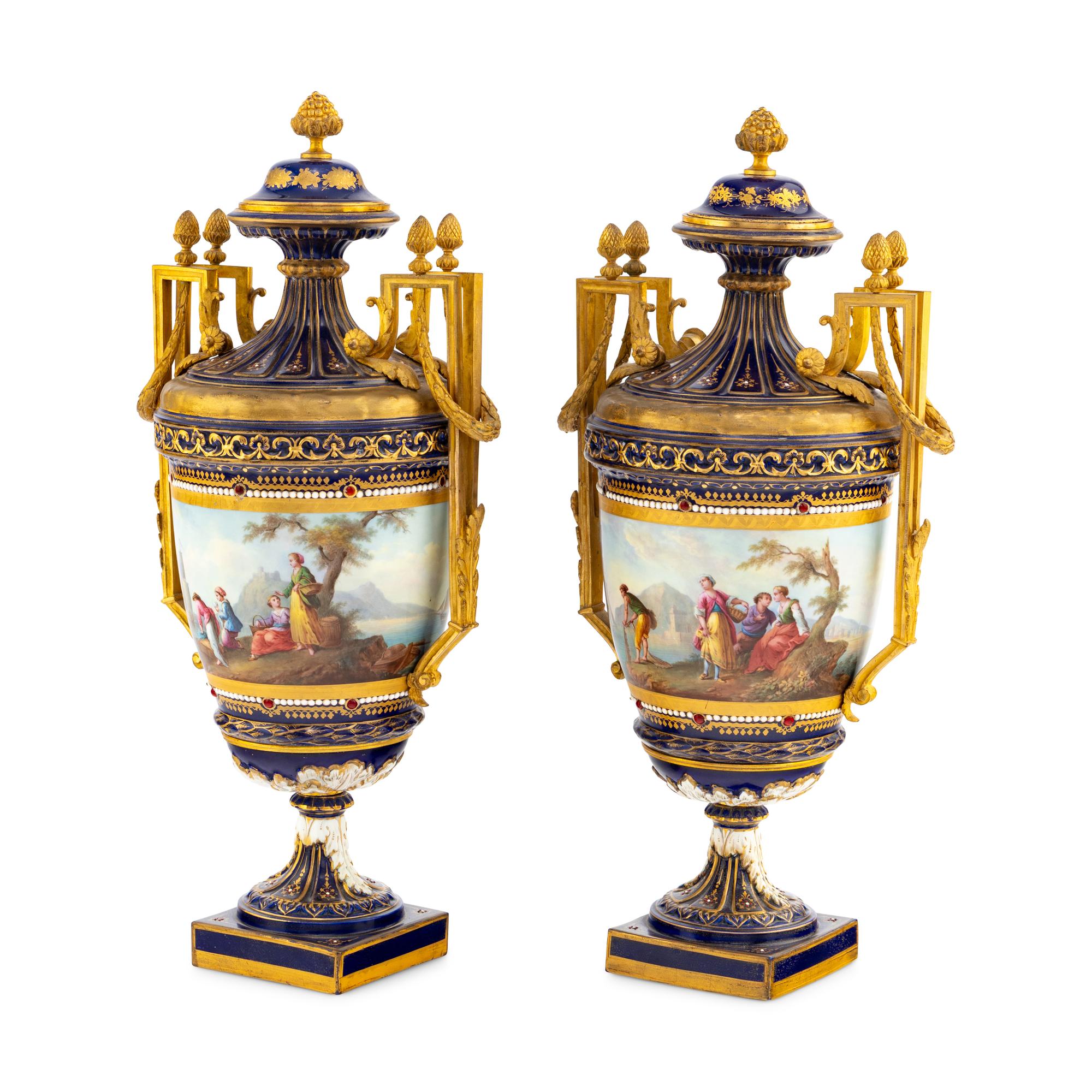 A Pair of Sèvres Style Gilt Bronze Mounted Porcelain Urns