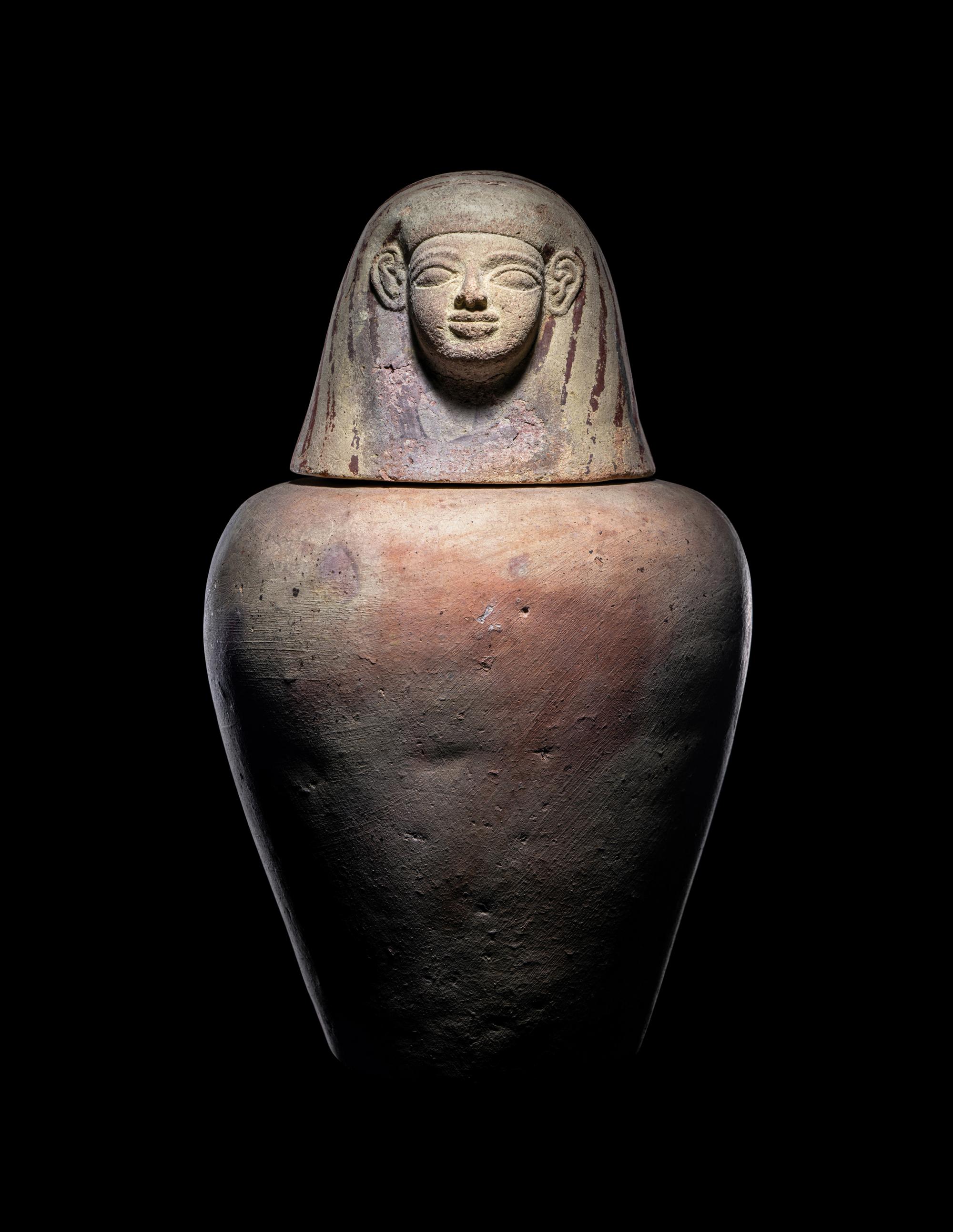 An Egyptian Painted Pottery Canopic Jar