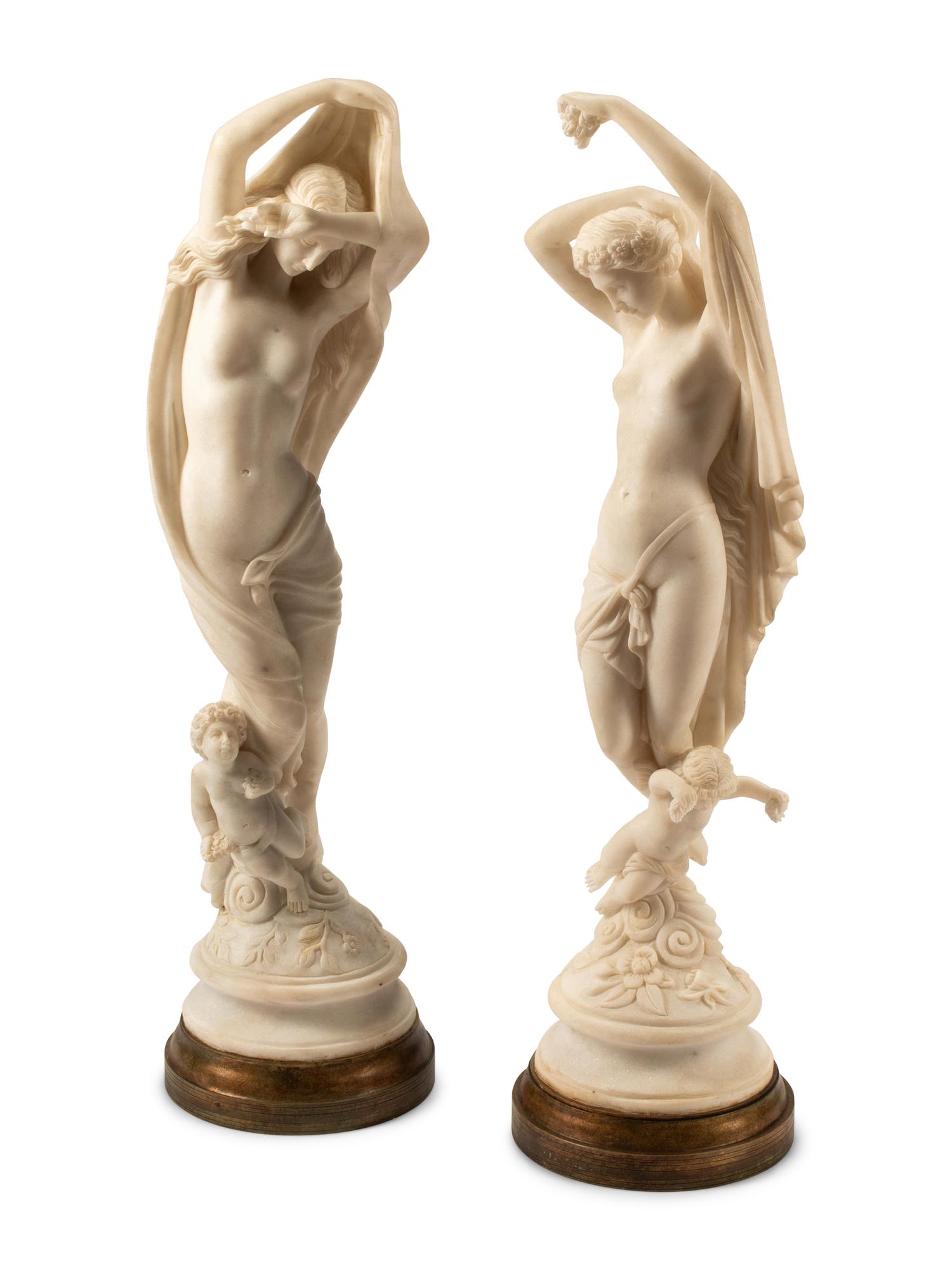 A Pair of Italian Marble Figures of Ladies with Cherubs