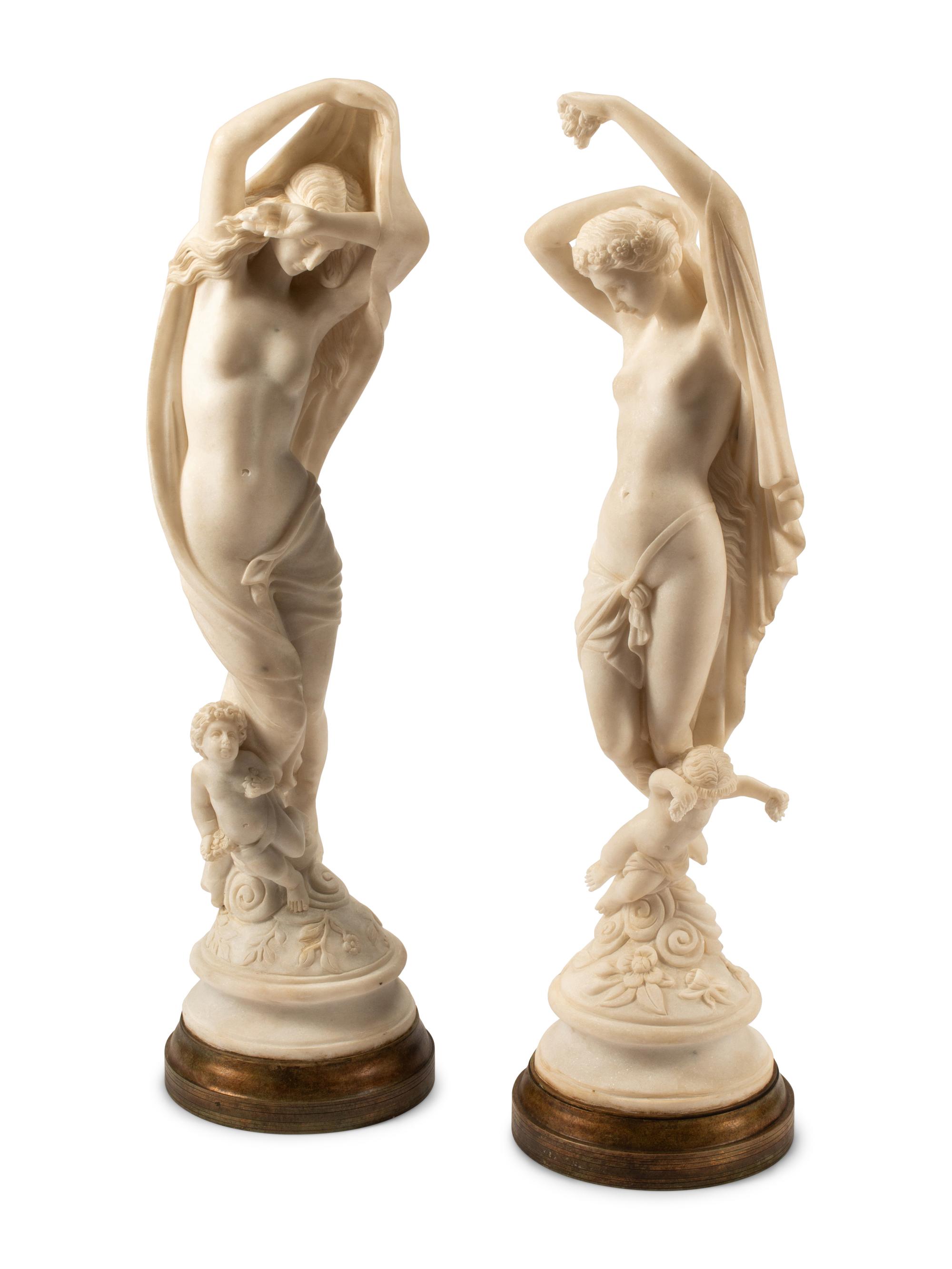 A Pair of Italian Marble Figures of Ladies with Cherubs