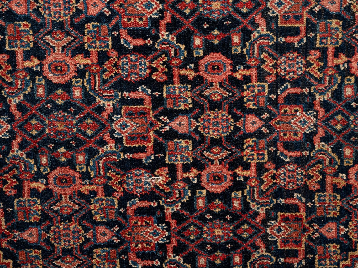 A Persian Senneh Wool Rug