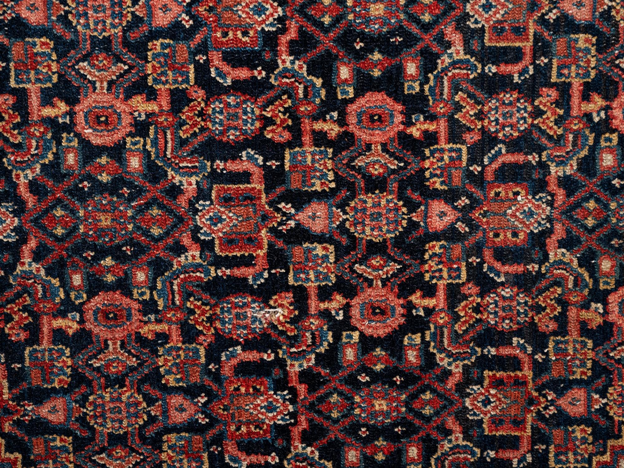 A Persian Senneh Wool Rug
