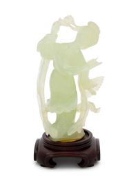 A Chinese Serpentine Figure of a Female Immortal
