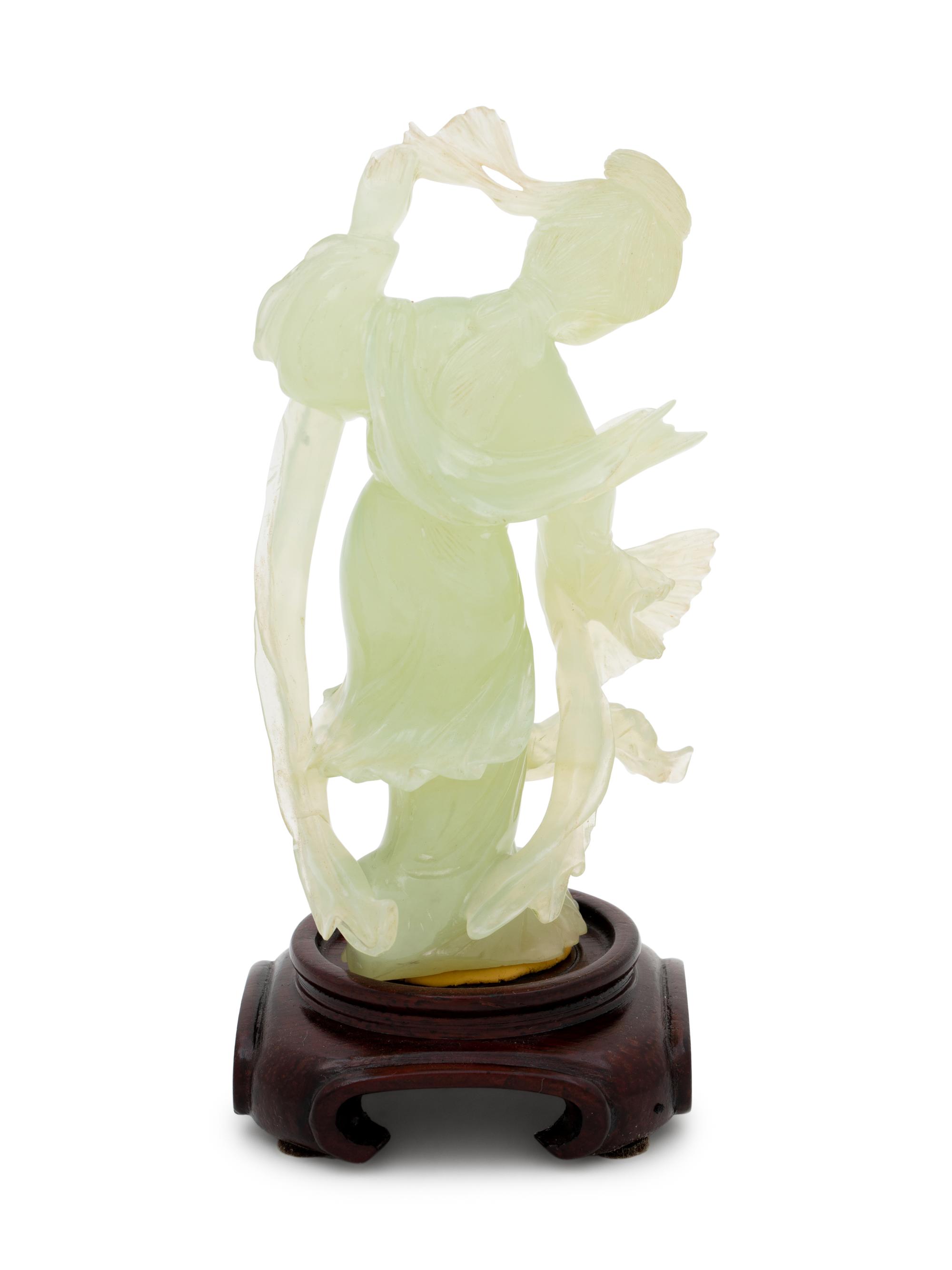 A Chinese Serpentine Figure of a Female Immortal