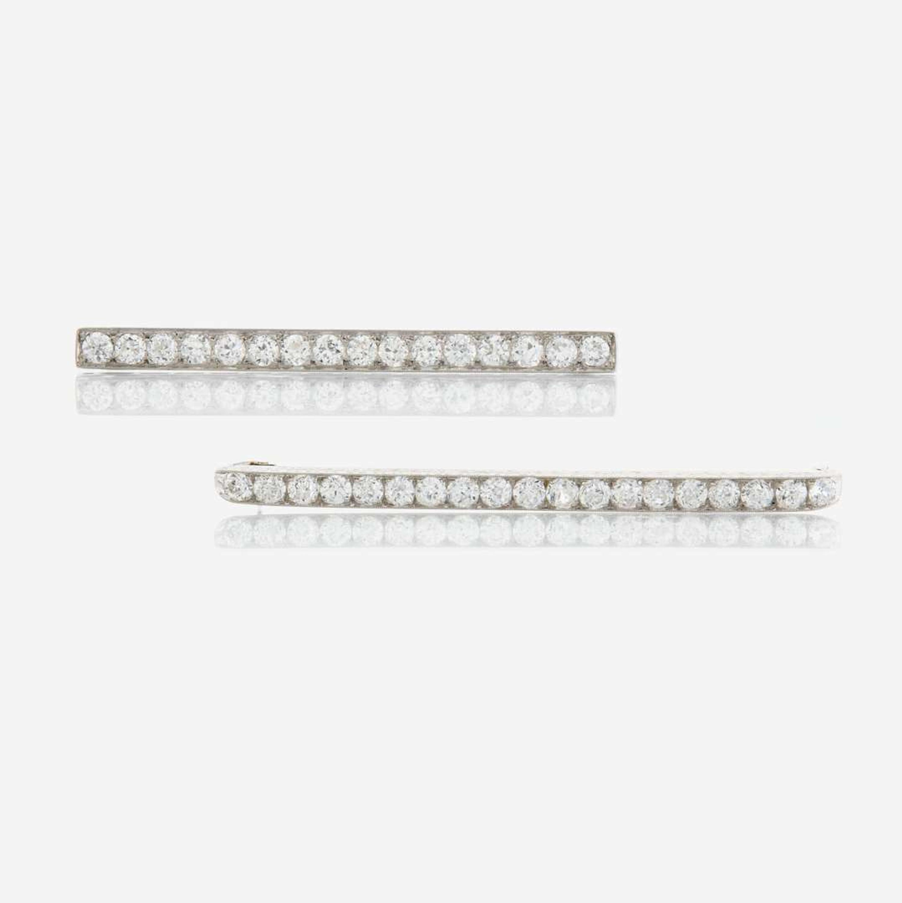 Two diamond and platinum brooches