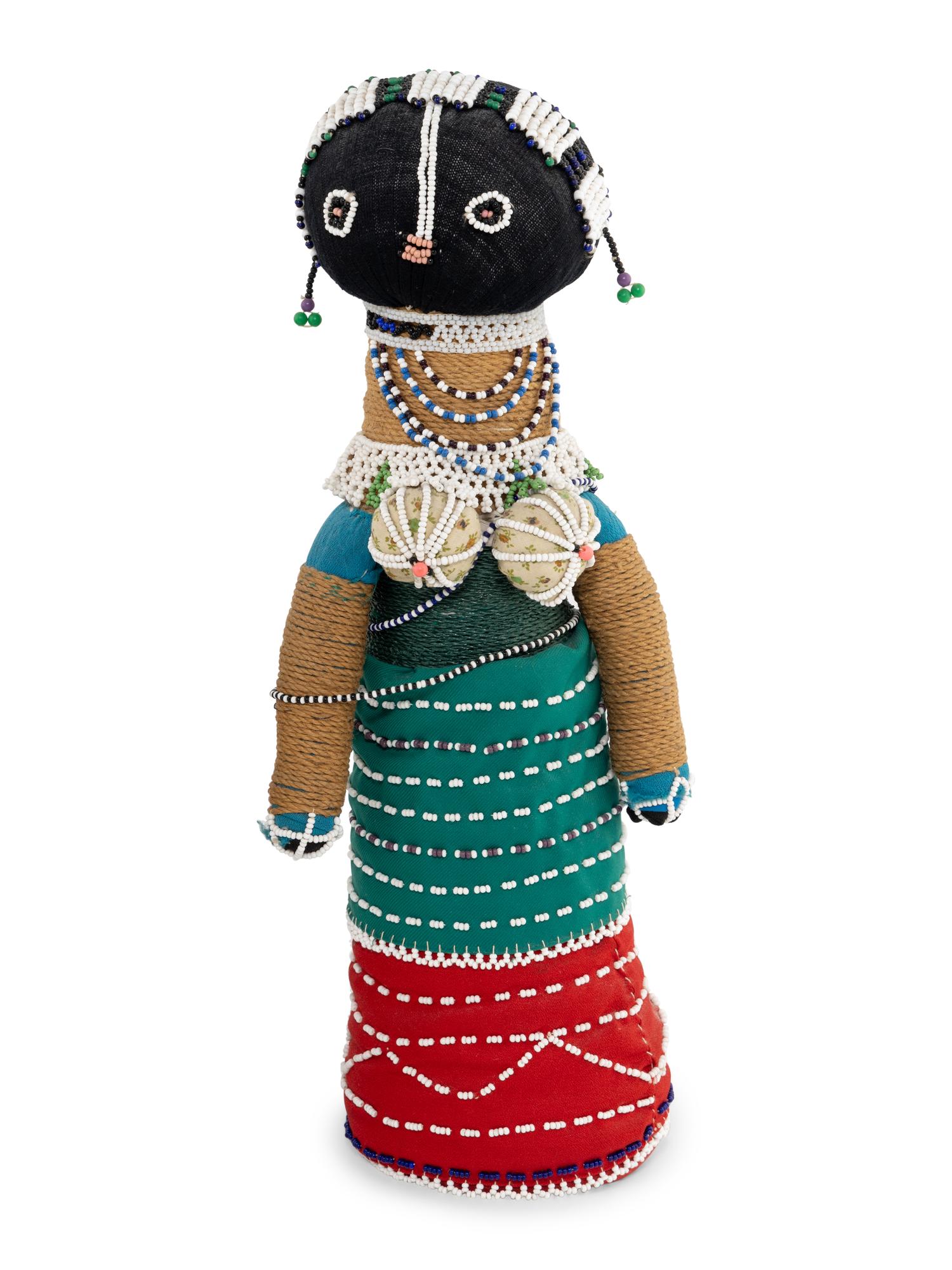 A Ndebele Doll, Two Dayak Baskets and Baby Carrier, and a Carved and Beaded Namji Doll