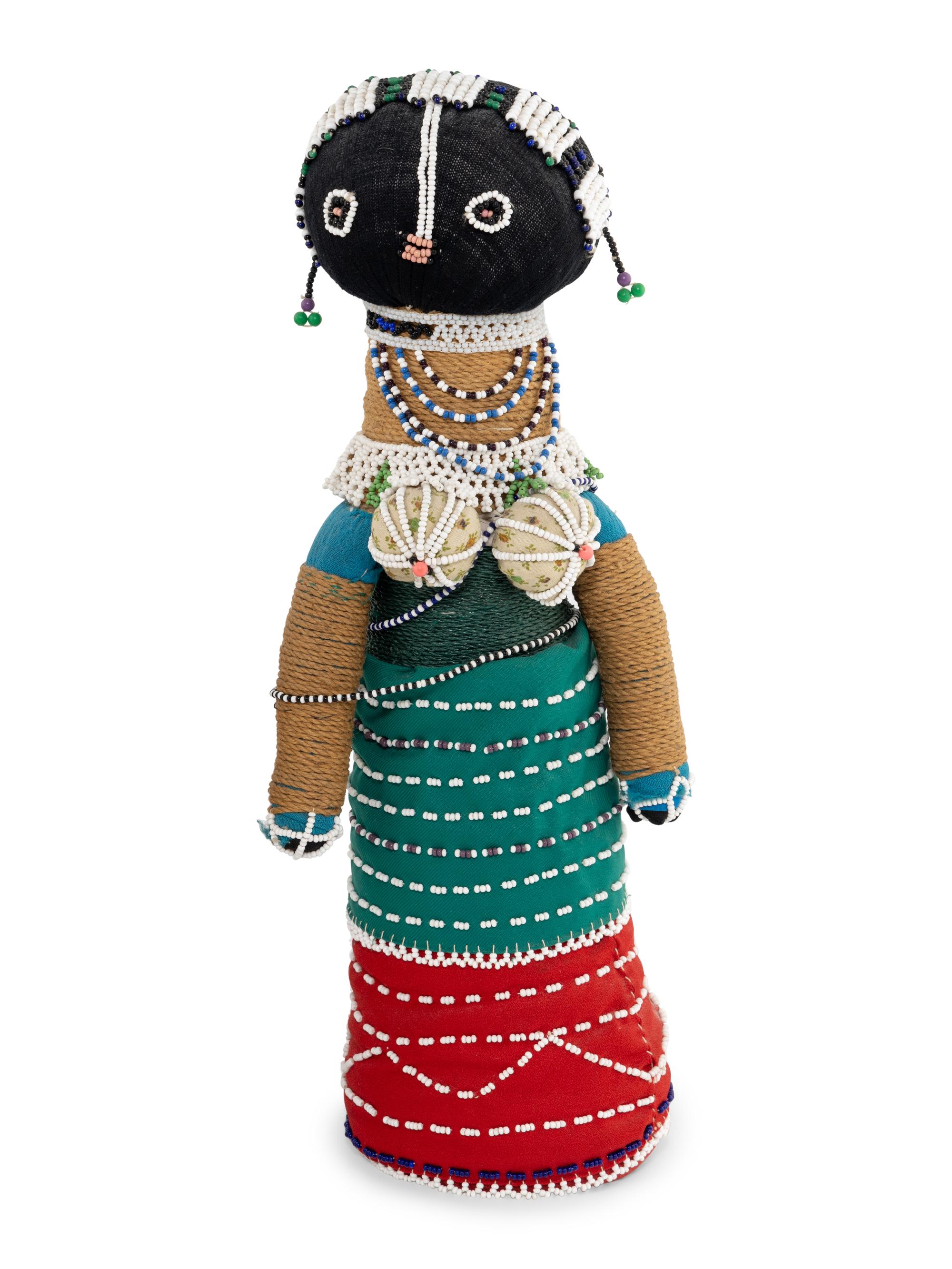 A Ndebele Doll, Two Dayak Baskets and Baby Carrier, and a Carved and Beaded Namji Doll