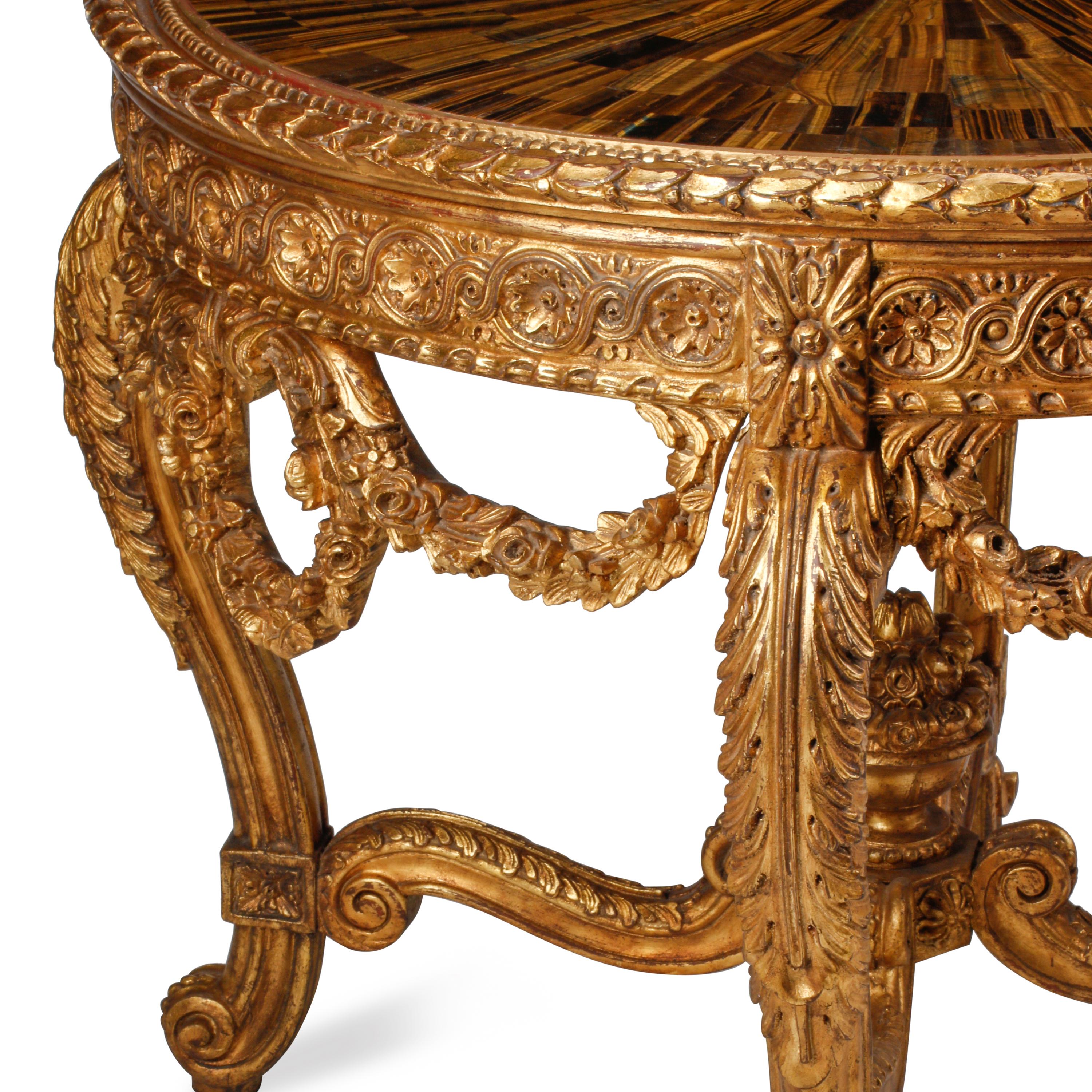 A Louis XVI Style Giltwood and Tiger's Eye Center Table