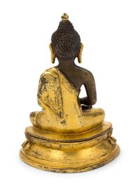 A Sino-Tibetan Gilt Bronze Figure of Medicine Buddha