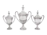 A Set of Three English Silver Covered Urns