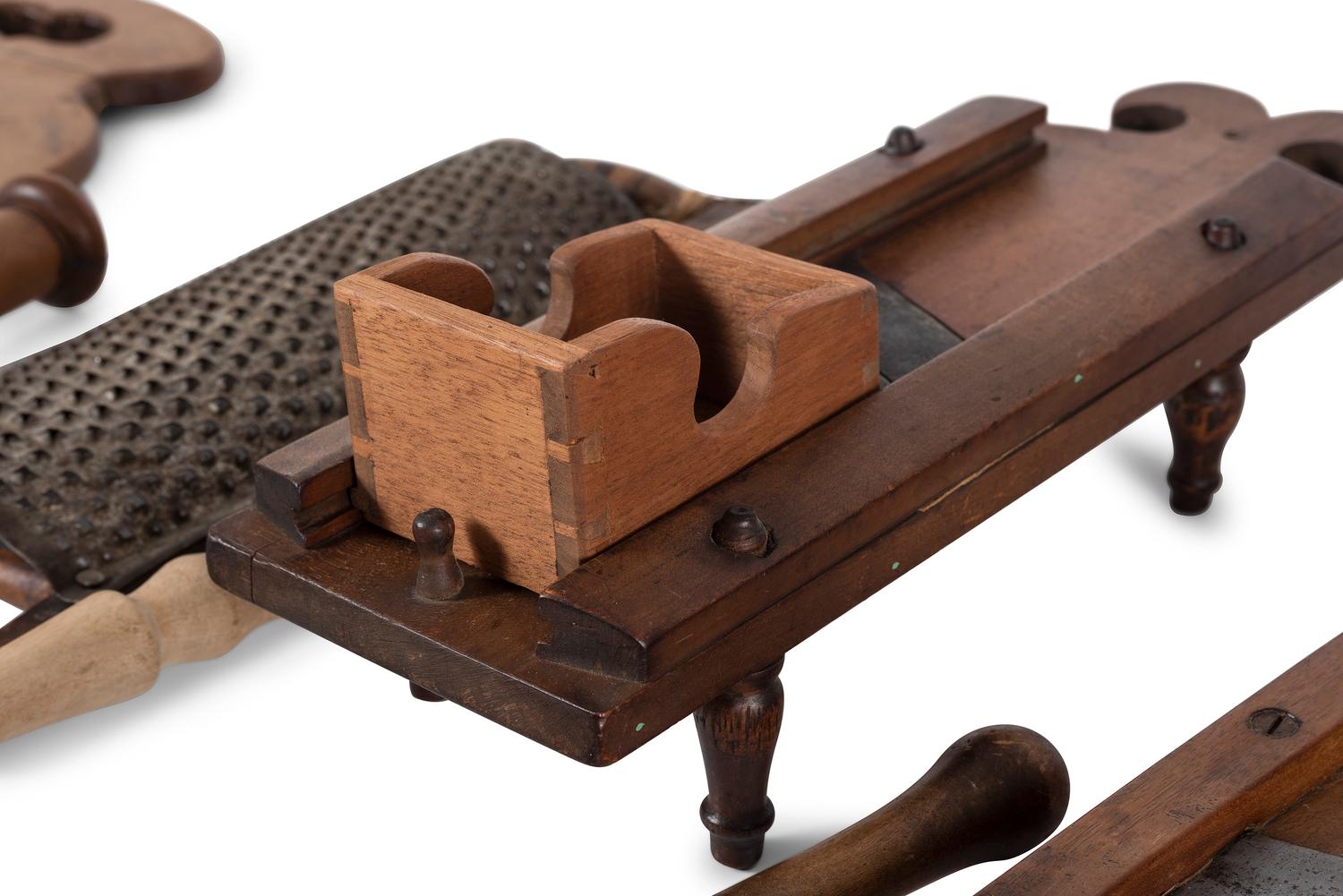 A Group of Wood and Tin Graters, Slicers and Pounders