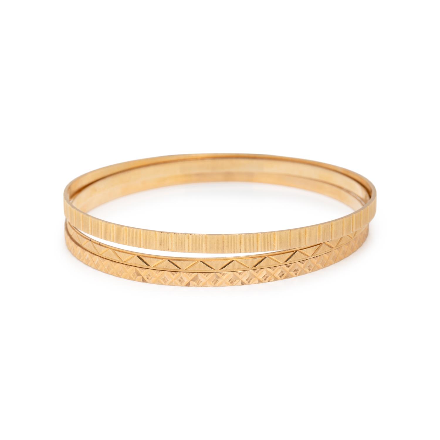 COLLECTION OF YELLOW GOLD BANGLE BRACELETS
