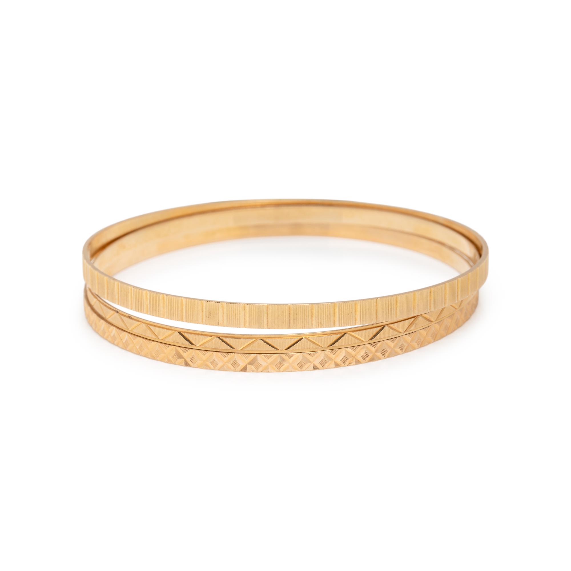 COLLECTION OF YELLOW GOLD BANGLE BRACELETS