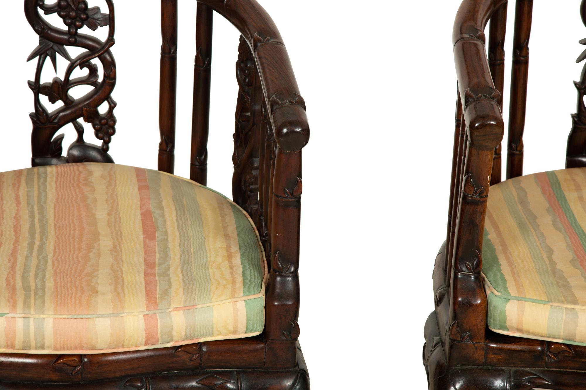 A Pair of Chinese Hongmu Horseshoe Back Carved Armchairs