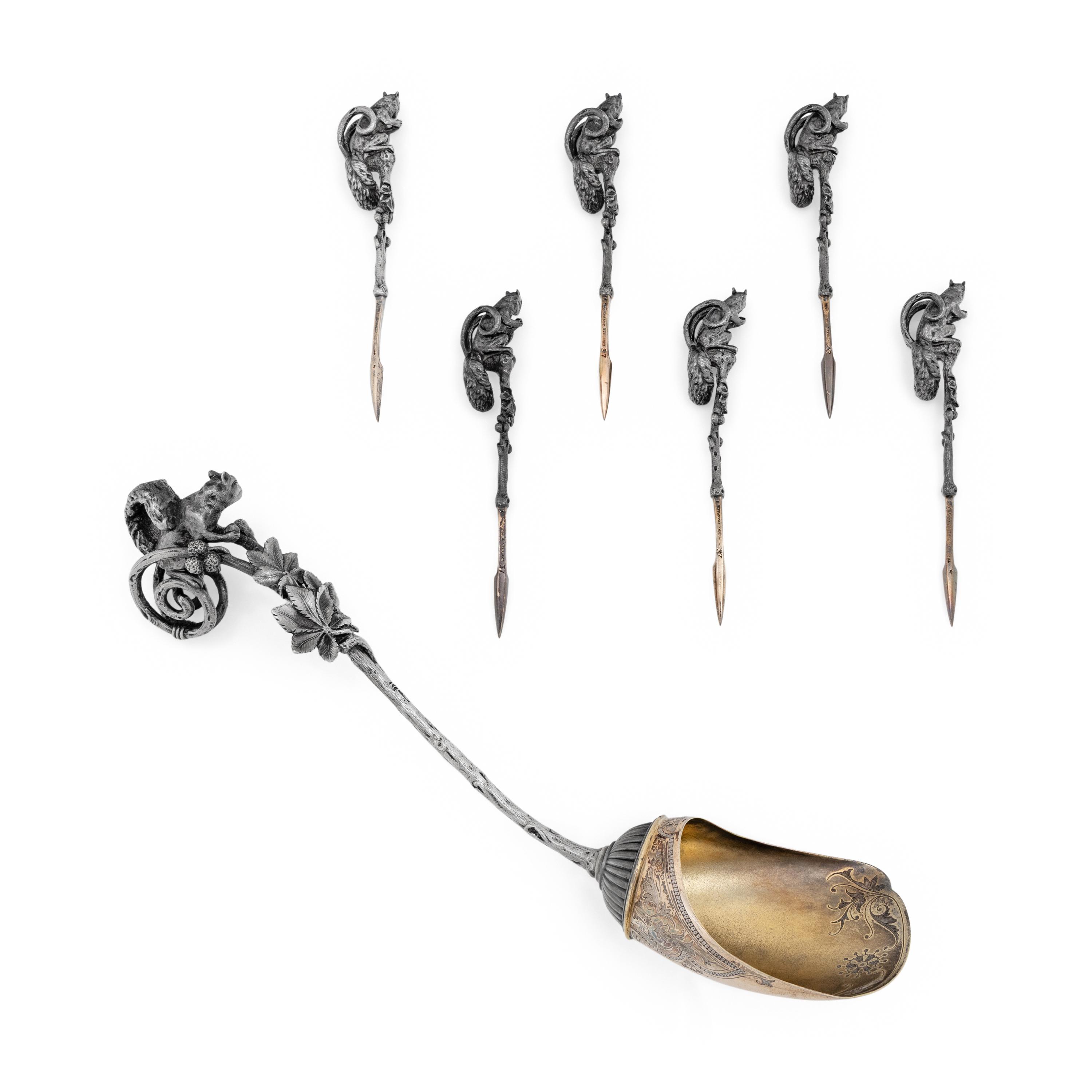 A Tiffany and Co. Silver Nut Scoop and Set of Six Nut Picks