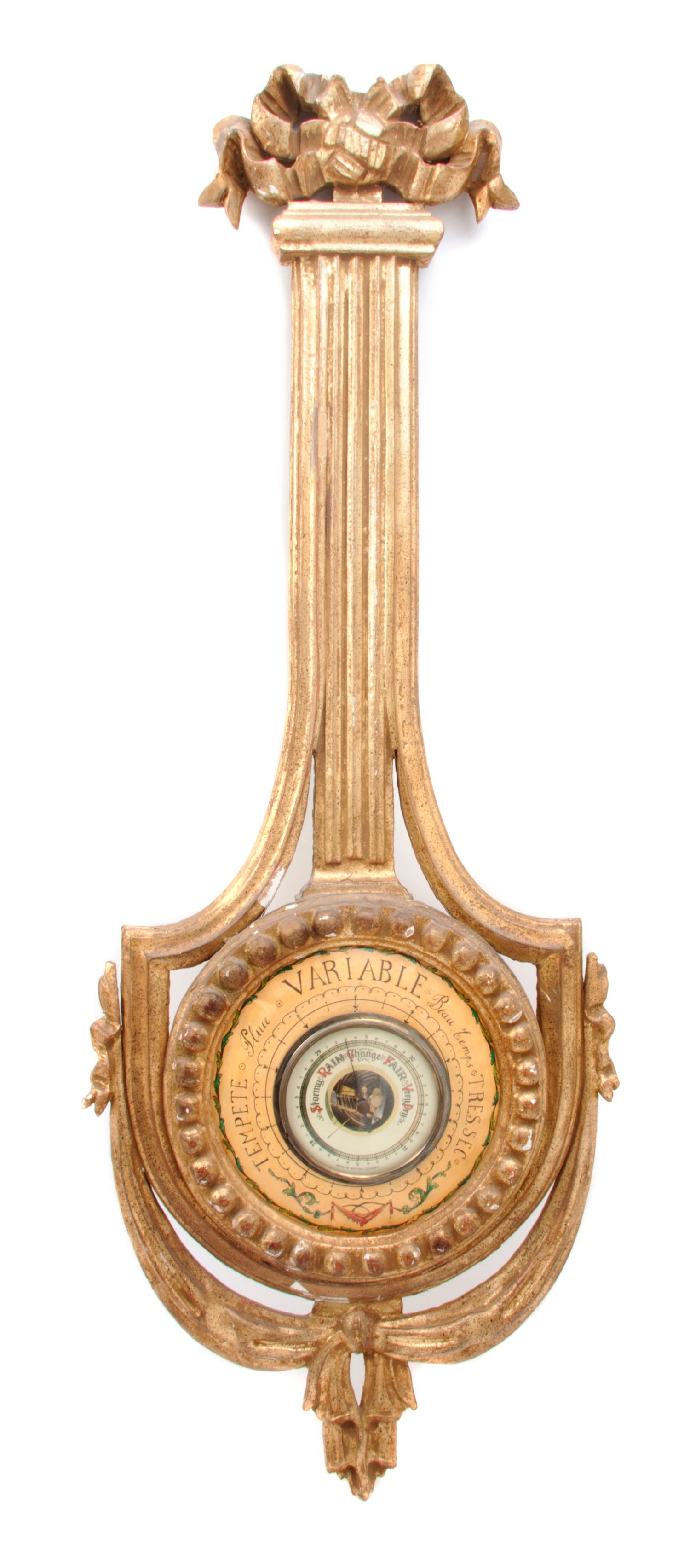 A Neoclassical Giltwood Wheel Barometer, Height 36 1/2 inches.