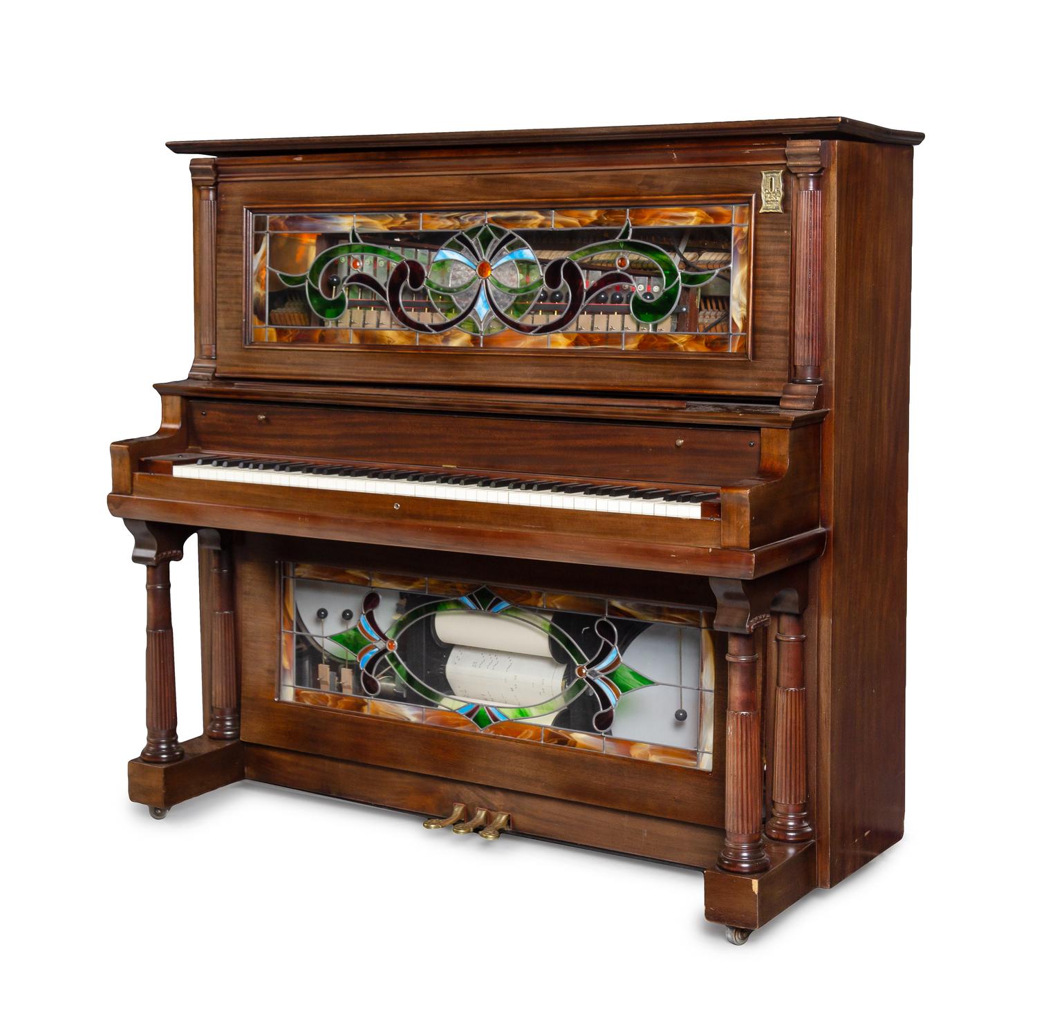 An American Mahogany and Leaded Glass Mounted Orchestrion with an Upholstered Bench