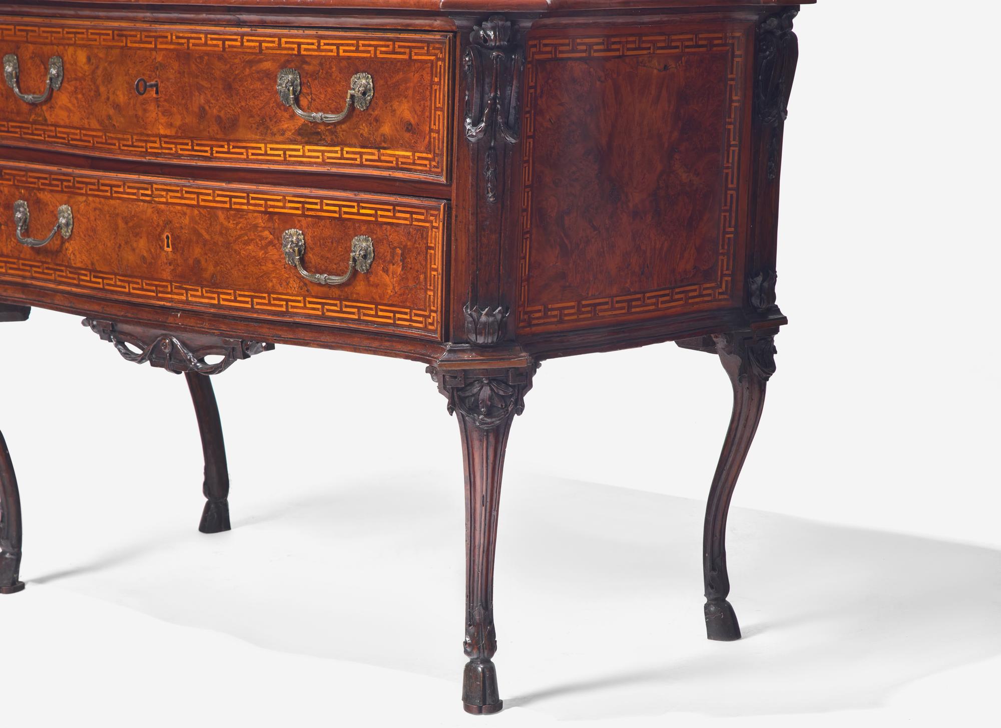 A Rococo Burr Walnut and Fruitwood Commode