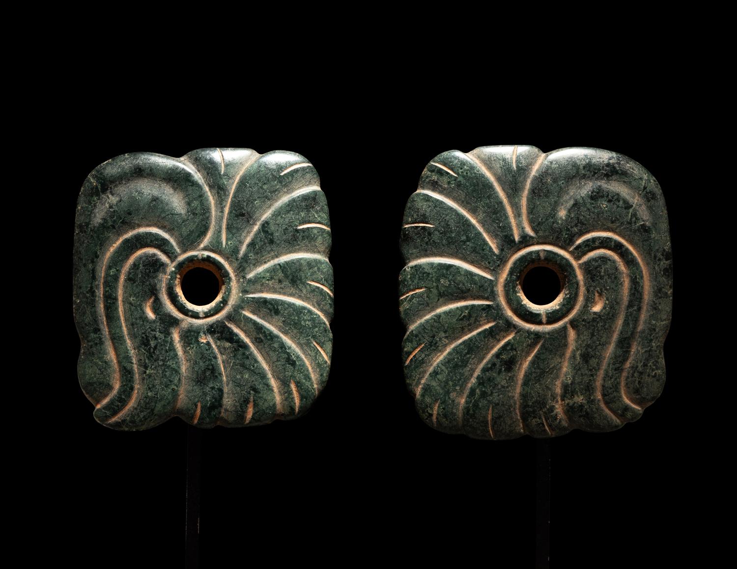 A Pair of Maya Jade Earspools in the Form of a Quetzal Bird