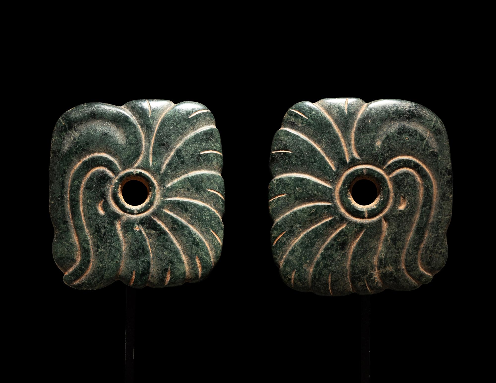 A Pair of Maya Jade Earspools in the Form of a Quetzal Bird