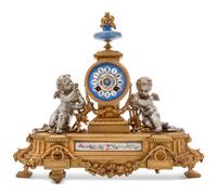 A French Porcelain Mounted Gilt and Silvered Bronze Mantel Clock